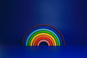 
wooden rainbow on a blue background