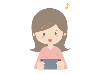 Woman playing on a portable game console