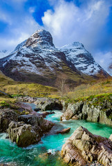 view of the River Coe and mountains in Glencoe, Highlands, Scotland, Uk.