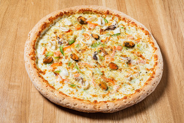 italian pizza on the wooden background