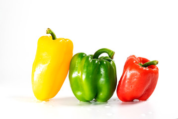 Plakat Group of 3 large fresh paprika , green, red, and yellow isolated on white background.