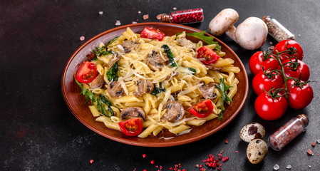 Pasta with mushrooms, cheese, spinach, rukkola and cherry tomatoes
