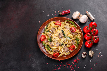 Pasta with mushrooms, cheese, spinach, rukkola and cherry tomatoes