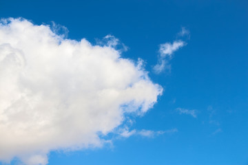 Beautiful cumulus cloud on the blue sky during spring sunny day. Theme of beautiful landscapes.