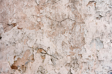 Texture of a concrete wall with cracks and scratches which can be used as a background