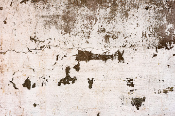 Texture of a concrete wall with cracks and scratches which can be used as a background