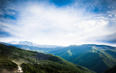 Fototapeta na wymiar Mountains rocks a relief a landscape a hill a panorama Caucasus top a slope clouds the sky a landscape