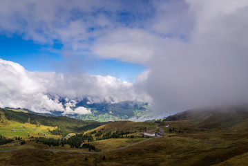 Fototapeta na wymiar Overlooking a mountain valley landscape in Kleine Scheidegg in the alpine region of Grindelwald, Switzerland