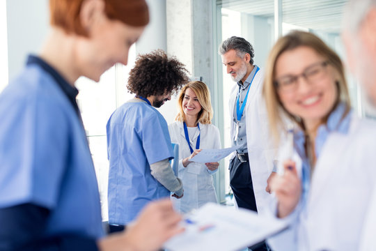 Group of doctors on conference, medical team discussing issues.