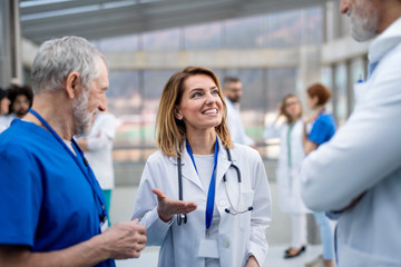 Group of doctors on conference, medical team discussing issues.