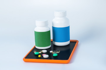 Two different bottles of vitamins on the smartphone