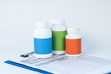 Three bottles of pills on the table