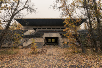 Grandstand of abandoned sports arena in Pripyat, Chernobyl Exclusion Zone in autumn