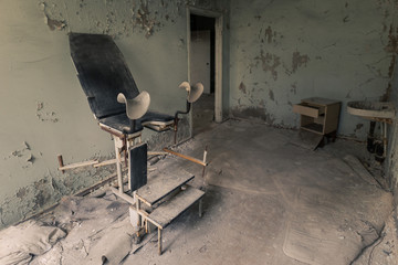 Gynecological chair in operating room in abandoned hospital in Pripyat, Chernobyl Exclusion Zone