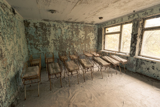 Rusty cribs in abandoned hospital in Pripyat, Chernobyl Exclusion Zone