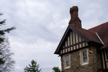 A Detailed Cobblestone Building on a Cloudy Sky