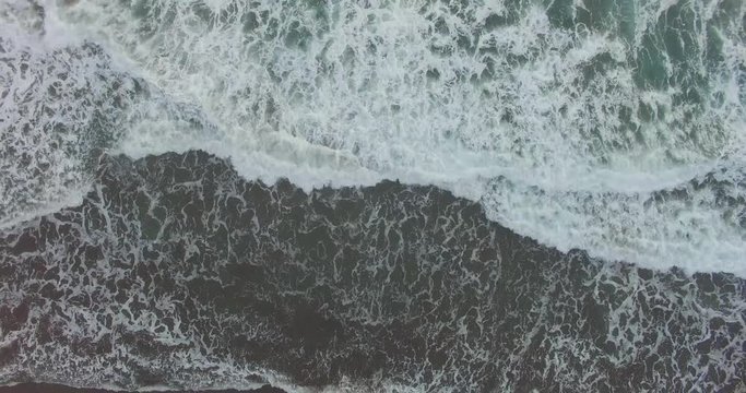 Aerial view of sea waves in hindia ocean in parangtritis beach,indonesia