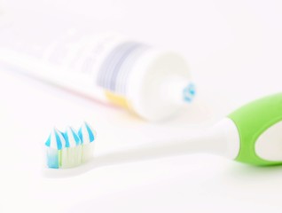 Toothbrush head with toothpaste and tube