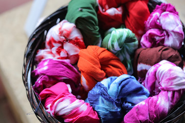 Fototapeta na wymiar Colorful Tie Dye Cloth, Various Tie Dye Fabric That is put in the basket
