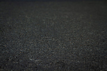 Black warm tar asphalt Soft focus. 