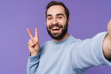 Handsome young man take a selfie by camera.