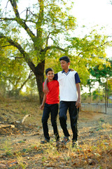 Obraz premium two little indian brother walking on road
