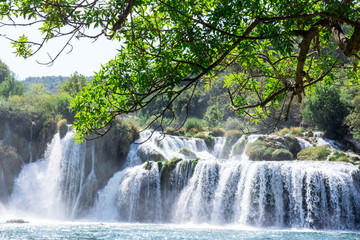 Fototapeta premium Breathtaking view Waterfalls of Krka National Park, Sunny day, summer season having greenery and trees, Croatia
