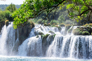 Fototapeta premium Breathtaking view Waterfalls of Krka National Park, Sunny day, summer season having greenery and trees, Croatia