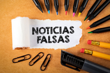 Noticias falsas  Means Fake News in Spanish. Panic, money fraud and politics concept