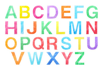 Set of letters written with color pencils on white background, top view