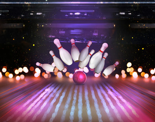Bowling ball bouncing pins, bokeh effect. Successful hit - strike - obrazy, fototapety, plakaty