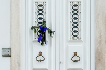 era cross on  the front door in celebration of Palm Sunday