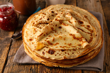 stack of crepe with jam and chocolate
