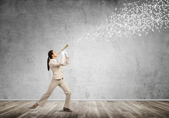 Woman playing trumpet brass instrument © adam121