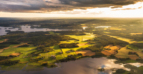 Finnish countryside at a sunny evening shot from an airplane