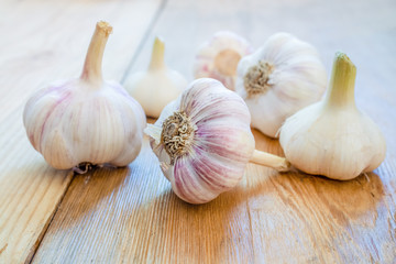 Garlic cloves on wooden background