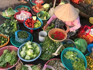 Women selling food on the market of Hoi An, Vietnam