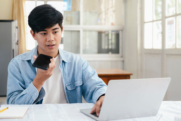Young man talking with handfree on the phone.