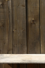 Empty shelf on wooden wall outdoor. Wood board wall and shelf  with copy space. .