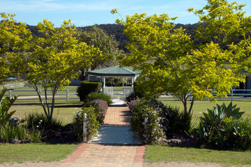 Mogo Australia, tranquil view across park to gazebo in spring
