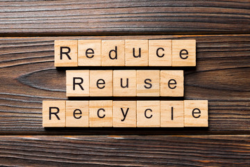 reduce, reuse and recycle word written on wood block. reduce, reuse and recycle text on wooden...