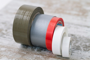 Rolls of adhesive tape of different types