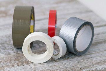 Rolls of adhesive tape of different types - obrazy, fototapety, plakaty