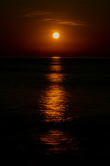 the reflection of the sun rose on the sea water