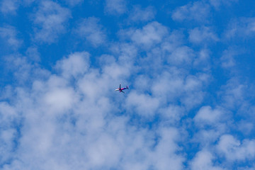 Commercial passenger airplane in the blue sky