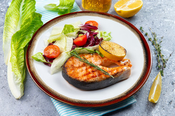 salmon steak and salad with tomatoes