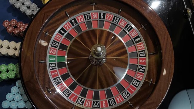 Spinning roulette and ball. Table top shot in slow motion