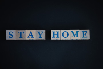 Cubes with words stay home. Concept for stopping the spread of coronavirus stay home.
