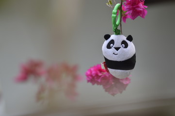 toy panda with flower