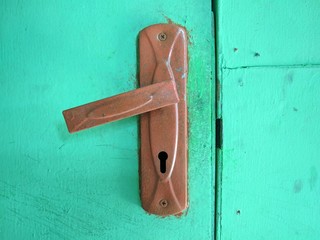 old door handles with green background